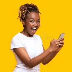 excited-black-woman-using-mobile-phone-got-new-nice-app-over-yellow-background-copy-space-194401295